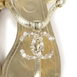 Chanel CC Jeweled Thong Sandals Gold Metallic 38C EU 19 Chanel CC Jeweled Thong Sandals Gold Metallic 38C EU -Online Bag Store C SH 240226 1 TC 08